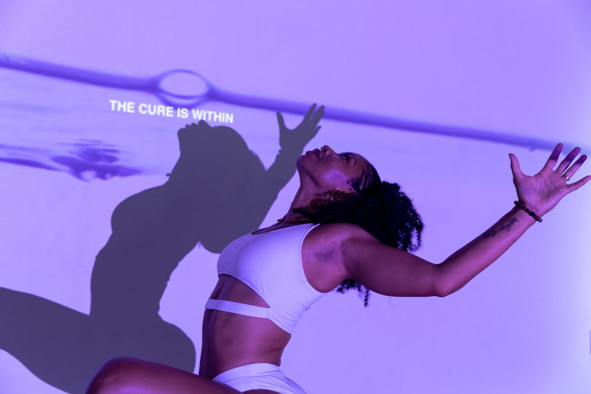 Expressive BUTI movement in projected purple light